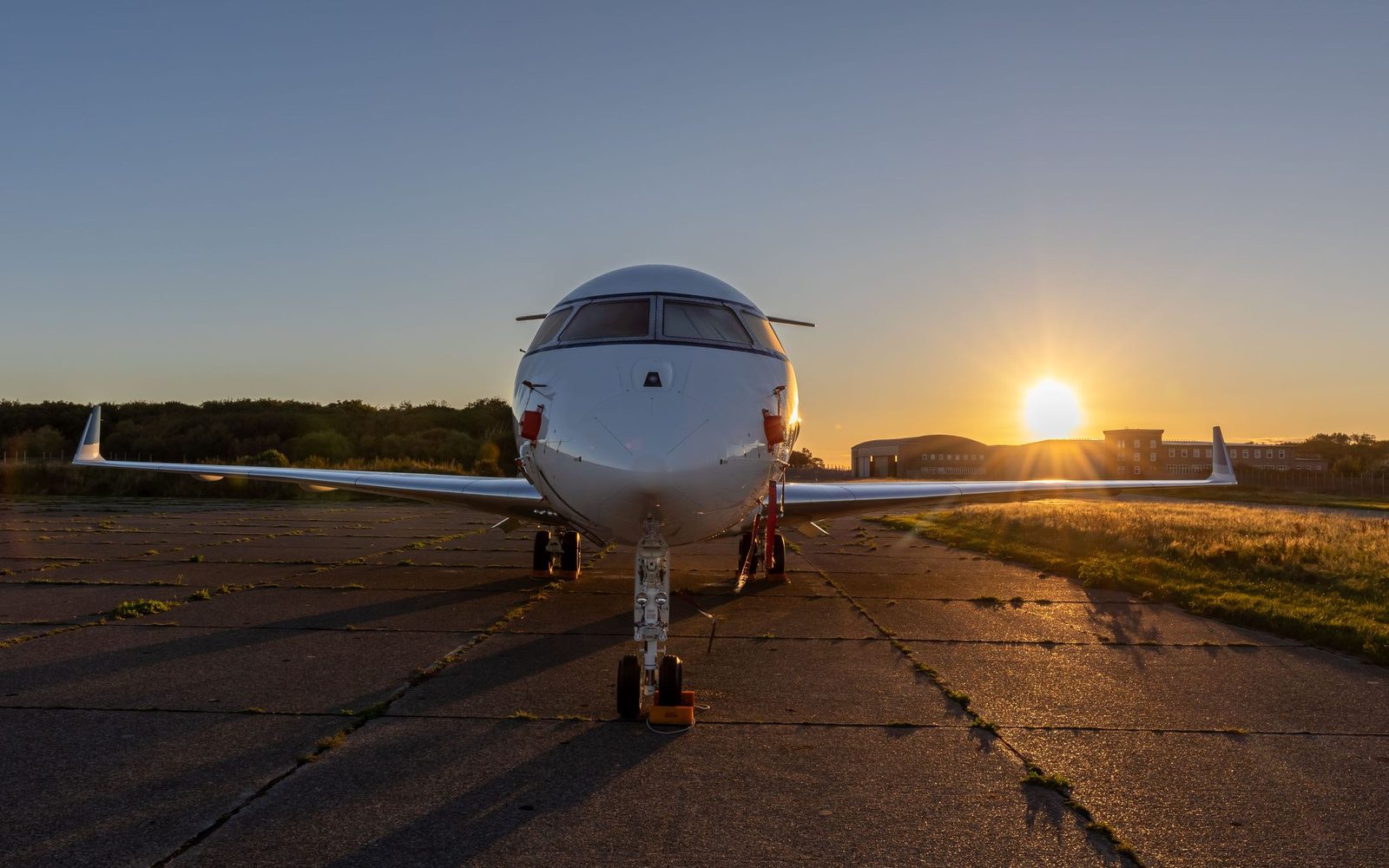 A business jet nose-on on an apron at sunset (stock photograph, not TM's aircraft)